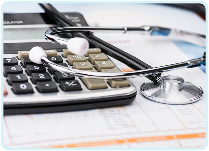 A stethoscope sitting on top of a calculator.